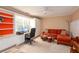 Bright office area with built-in shelving, a cozy lounge area and work space at 4801 Deer Chase, Powder Springs, GA 30127