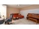 Multi-purpose room features built-in shelving, work space, piano and a lounge area at 4801 Deer Chase, Powder Springs, GA 30127