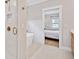Bright bathroom featuring a glass shower with bronze fixtures and a luxurious white soaking tub at 1010 Fendley St, Woodstock, GA 30188