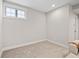 The bedroom features neutral walls, a window, and carpet flooring at 1010 Fendley St, Woodstock, GA 30188