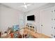 Bright, airy bedroom featuring a ceiling fan, and a window at 1010 Fendley St, Woodstock, GA 30188