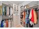 Well-organized walk-in closet with multiple racks, shelves, drawers and hardwood flooring at 1010 Fendley St, Woodstock, GA 30188