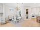 Dining room with chandelier and seating for six near the kitchen at 1010 Fendley St, Woodstock, GA 30188