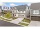 Exterior view of home showing driveway and landscaping in a suburban neighborhood at 1010 Fendley St, Woodstock, GA 30188
