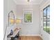 Bright foyer with hardwood floors, console table, and a view to the outside at 1010 Fendley St, Woodstock, GA 30188