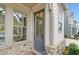 Close-up of the front door with a glass panel and stone accents at 1010 Fendley St, Woodstock, GA 30188