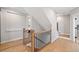 This hallway features wood handrails and hardwood floors at 1010 Fendley St, Woodstock, GA 30188