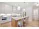 Modern kitchen with white cabinets, quartz countertops, and stainless steel appliances at 1010 Fendley St, Woodstock, GA 30188