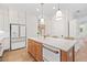 Kitchen with stainless steel refrigerator and white cabinets at 1010 Fendley St, Woodstock, GA 30188