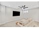 This living room has neutral walls, a ceiling fan, and comfortable seating at 1010 Fendley St, Woodstock, GA 30188
