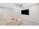 This living room has neutral walls, carpet flooring, and comfortable seating at 1010 Fendley St, Woodstock, GA 30188