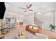Open concept living room with hardwood floors and ample seating areas at 1010 Fendley St, Woodstock, GA 30188