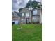 Inviting two-story home with brick facade, attached garage, and lush green lawn at 1962 Bridgestone Cir, Conyers, GA 30012