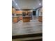 Open kitchen featuring modern appliances, island, and views to the connecting room at 1962 Bridgestone Cir, Conyers, GA 30012