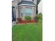 Close-up of landscaping with decorative stone edging and lush green grass at 1962 Bridgestone Cir, Conyers, GA 30012