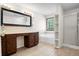 Bathroom featuring a double vanity, soaking tub, and walk-in shower at 3185 Oak Ridge Ln, Loganville, GA 30052