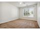 Bright bedroom with carpeting, ceiling fan, neutral walls and a window at 3185 Oak Ridge Ln, Loganville, GA 30052