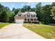 Charming two-story home with brick facade, attached garage, and a well-manicured front yard at 3185 Oak Ridge Ln, Loganville, GA 30052