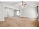 Spacious living room with ceiling fan, vaulted ceilings, and natural light at 3185 Oak Ridge Ln, Loganville, GA 30052