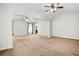 Open living room with ceiling fans and natural light, ready for entertaining at 3185 Oak Ridge Ln, Loganville, GA 30052