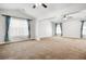 Bright living room with vaulted ceilings, fans, and ample natural light at 3185 Oak Ridge Ln, Loganville, GA 30052