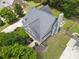Aerial view of a charming home with a gray roof, manicured lawn, and an inviting outdoor firepit area at 330 Bay Grove Rd, Loganville, GA 30052