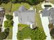 Aerial view of a charming home with pool, fire pit, mature trees, and well-manicured lawns at 330 Bay Grove Rd, Loganville, GA 30052
