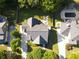 Aerial view of the home highlighting the roof, green lawn, and the nearby swimming pool at 330 Bay Grove Rd, Loganville, GA 30052