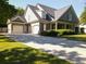 Charming home with a three-car garage, featuring a lovely front porch with beautiful columns and meticulous landscaping at 330 Bay Grove Rd, Loganville, GA 30052