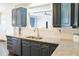 Contemporary kitchen with granite countertops, and stainless steel appliances, with view to breakfast nook at 330 Bay Grove Rd, Loganville, GA 30052