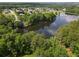 Scenic aerial view of the large lake near homes and a surrounding lush tree line at 330 Bay Grove Rd, Loganville, GA 30052