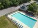 Aerial view of a community pool surrounded by lounge chairs and landscaped areas at 330 Bay Grove Rd, Loganville, GA 30052
