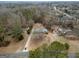 Aerial view of the property showcasing the house, long driveway, and wooded surroundings at 3421 Fawn Trl, Marietta, GA 30066