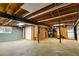 Unfinished basement with exposed beams, storage area, and utility equipment at 3421 Fawn Trl, Marietta, GA 30066