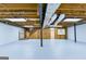Large unfinished basement with exposed ceiling, duct work and wooden stairs adds potential living space at 3421 Fawn Trl, Marietta, GA 30066