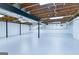 A freshly painted basement with exposed ceiling beams and support columns, offering potential for customization and added living space at 3421 Fawn Trl, Marietta, GA 30066