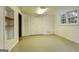 Finished basement area with built-in shelving, closet, and natural light from the double windows at 3421 Fawn Trl, Marietta, GA 30066