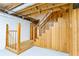 Basement staircase with wood paneling and railing, and exposed ceiling at 3421 Fawn Trl, Marietta, GA 30066