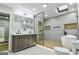 Modern bathroom featuring a double vanity, glass shower, soaking tub, and skylight for natural light at 3421 Fawn Trl, Marietta, GA 30066