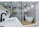 Bright bathroom with a double sink vanity, glass shower, standalone tub, and modern fixtures at 3421 Fawn Trl, Marietta, GA 30066