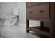 Modern bathroom featuring a white toilet and vanity with storage, enhanced by stylish fixtures at 3421 Fawn Trl, Marietta, GA 30066