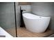Modern bathroom with freestanding tub, sleek black faucet, and gray tiled wall at 3421 Fawn Trl, Marietta, GA 30066