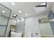 Bathroom with skylights, walk-in shower, soaking tub, and gray tile at 3421 Fawn Trl, Marietta, GA 30066