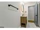 Beautiful bathroom with a modern vanity, illuminated round mirror, and a sleek towel rack at 3421 Fawn Trl, Marietta, GA 30066