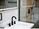 Modern bathroom vanity with sleek black faucet and framed LED mirror at 3421 Fawn Trl, Marietta, GA 30066