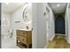 Well-lit bathroom with a modern vanity, round mirror, and toilet at 3421 Fawn Trl, Marietta, GA 30066