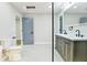 Bathroom featuring a double vanity, soaking tub, and adjacent rooms at 3421 Fawn Trl, Marietta, GA 30066