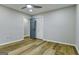 This bedroom features wood floors, closet and a ceiling fan with light, offering a comfortable and stylish space at 3421 Fawn Trl, Marietta, GA 30066