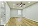 Bright bedroom with a ceiling fan, features wood floors and a view to an ensuite bath, a comfortable and stylish living space at 3421 Fawn Trl, Marietta, GA 30066