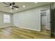 Bright bedroom with hardwood floors, a ceiling fan, and an open doorway at 3421 Fawn Trl, Marietta, GA 30066